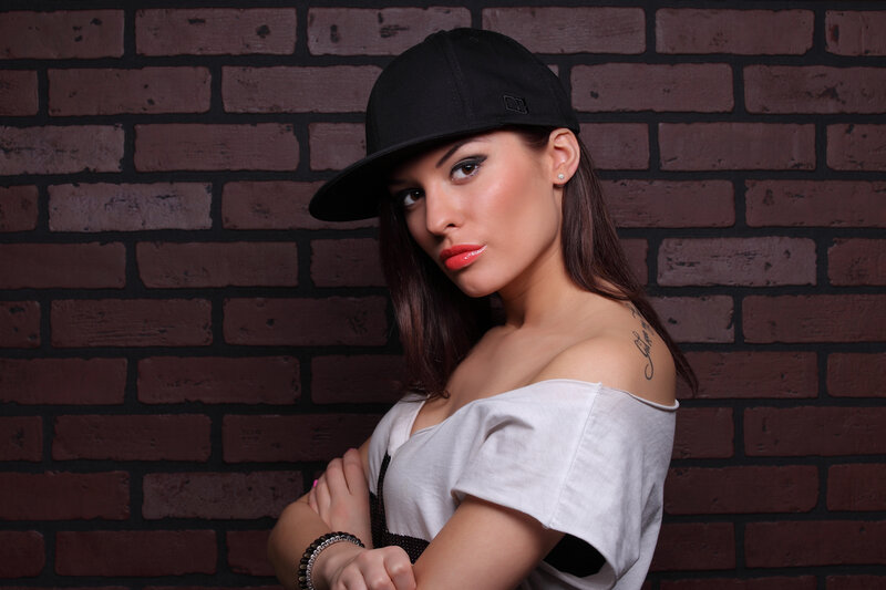 Woman in Cap and Off-shoulder Top
