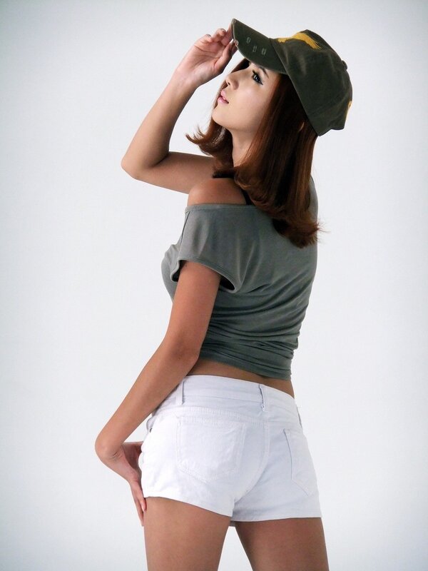 woman in cap and shorts