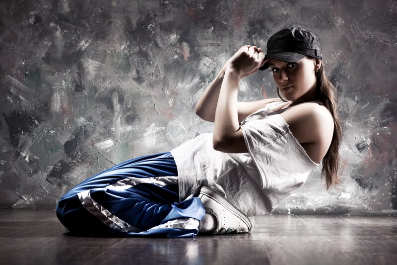 woman in cap and sneakers