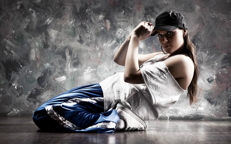 Woman in Cap and Sneakers — White, Dramatic