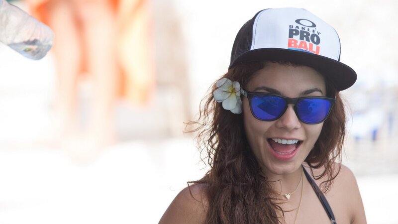 Woman in cap and sunglasses