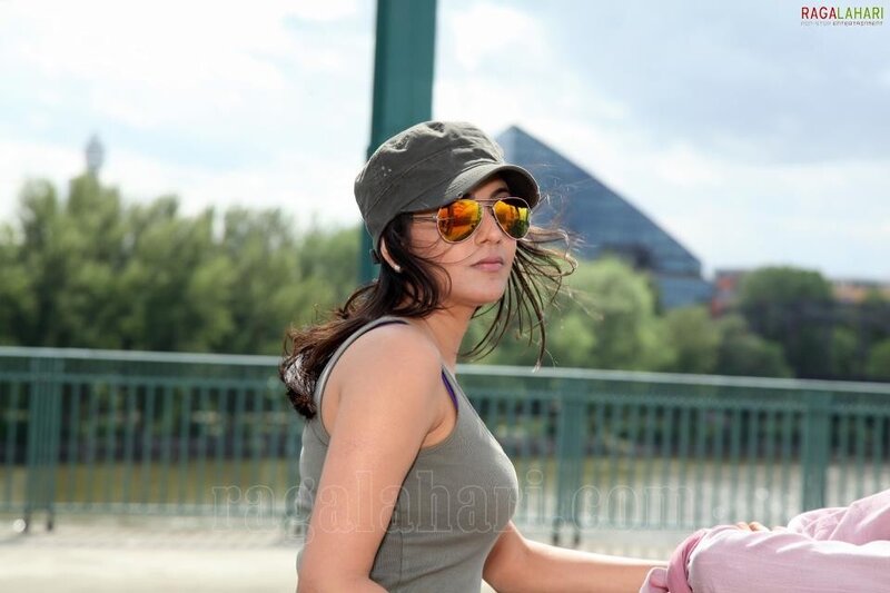 woman in cap and sunglasses