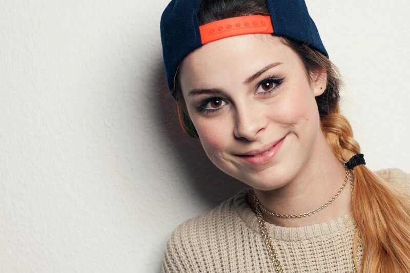 woman in cap and sweater