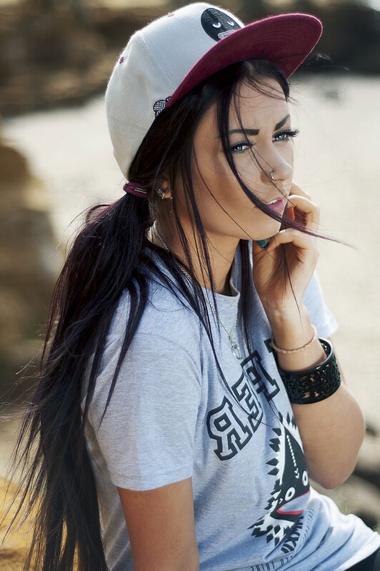 woman in cap and t-shirt
