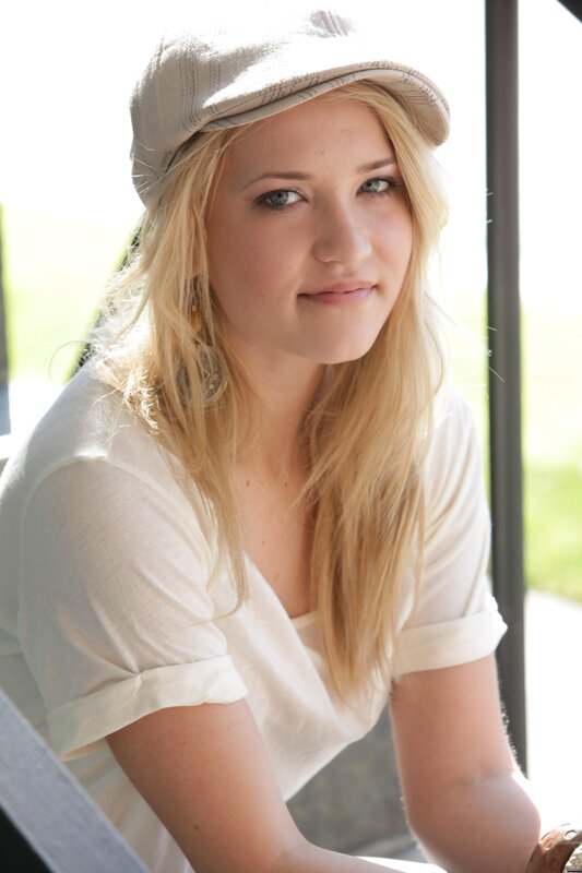 woman in cap and white shirt