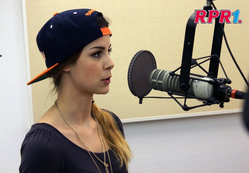 Woman in Cap at Microphone