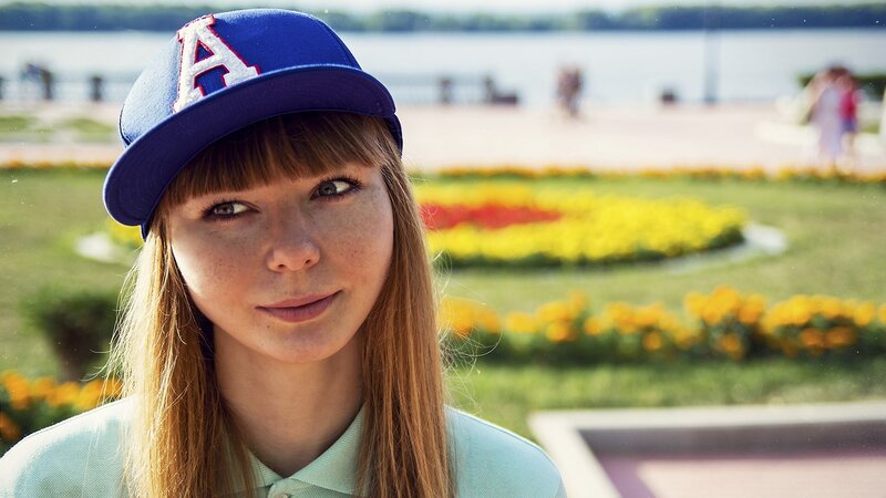woman in cap at park
