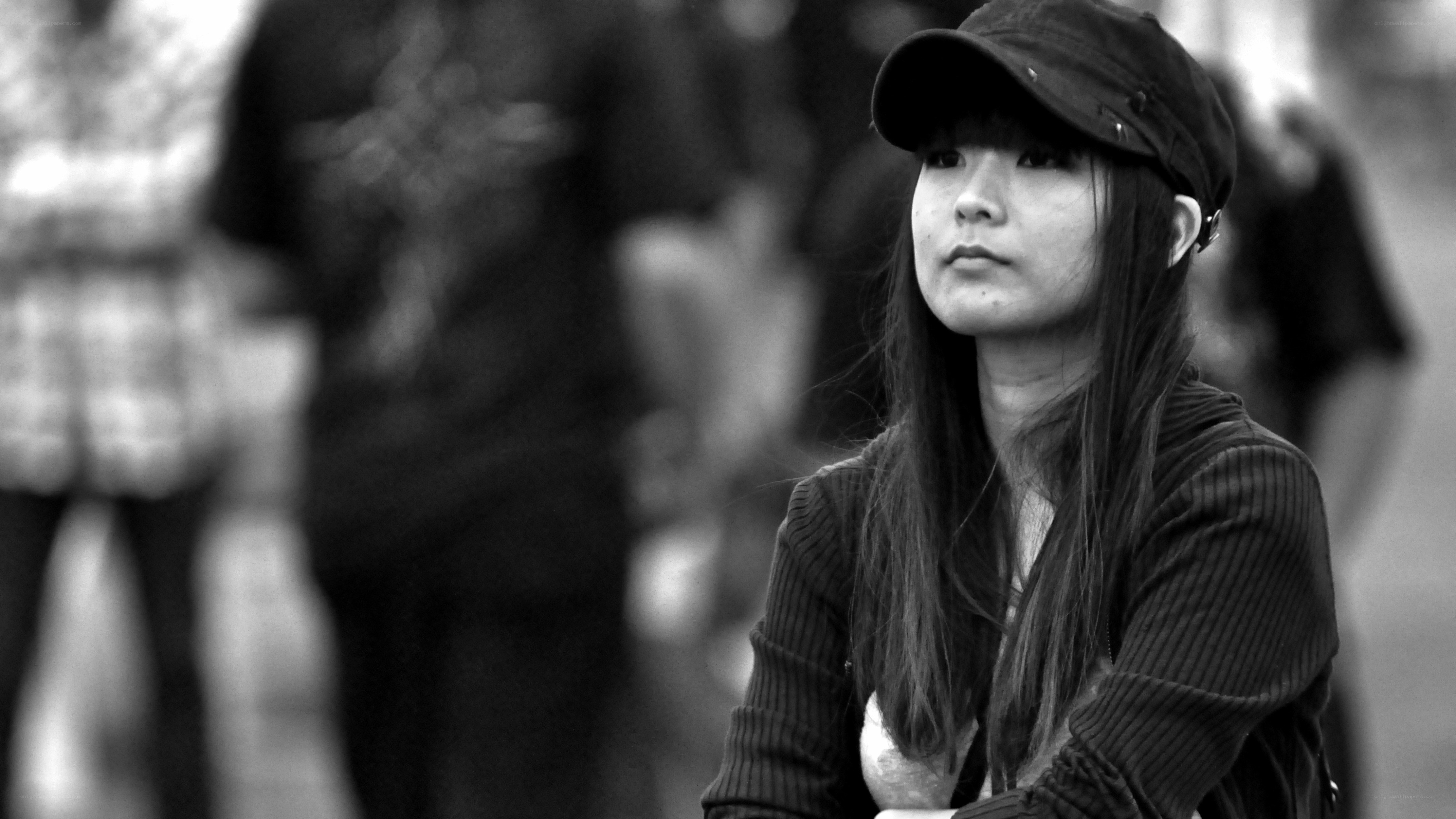 woman in cap looking away
