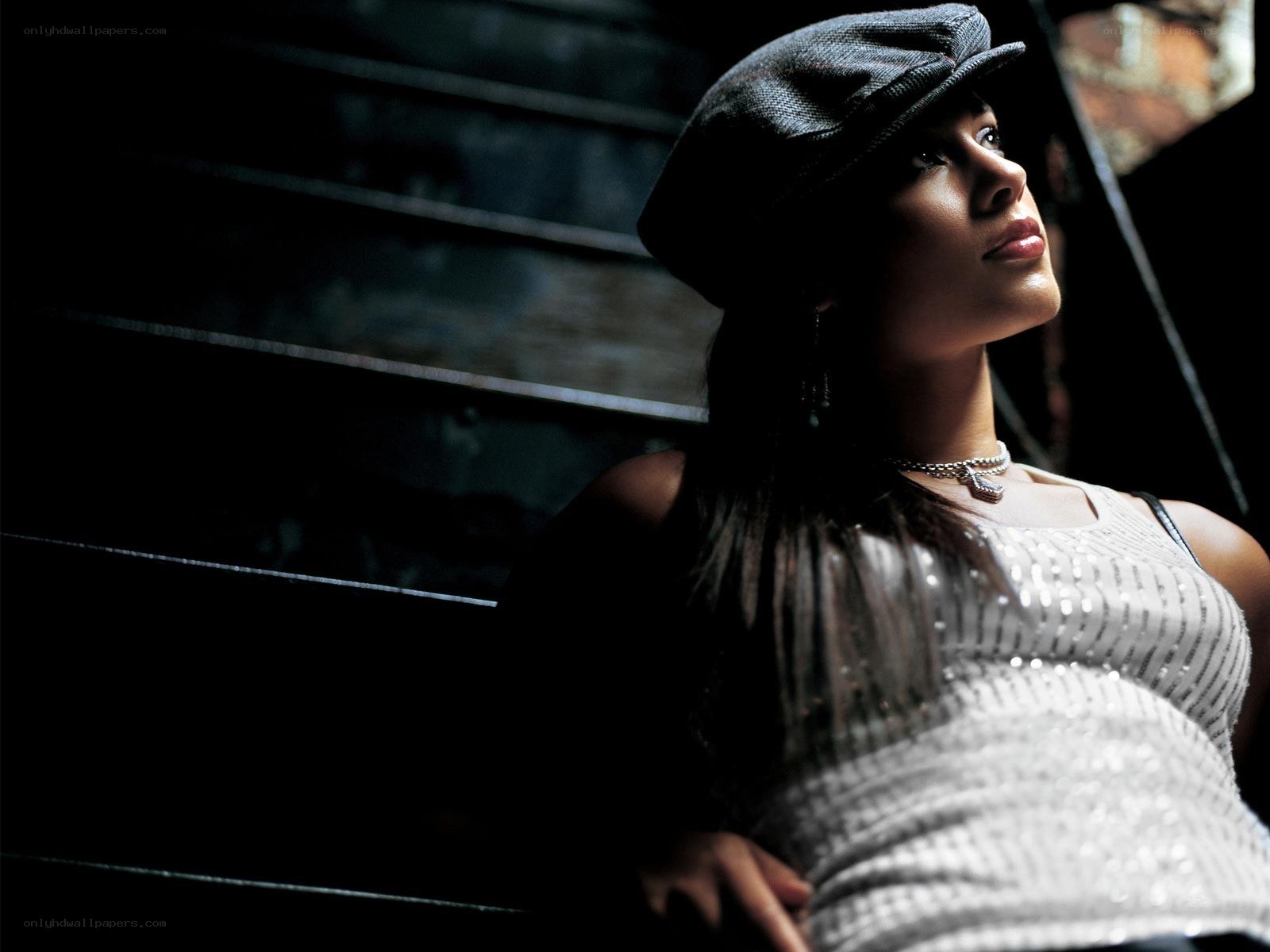 woman in cap looking up