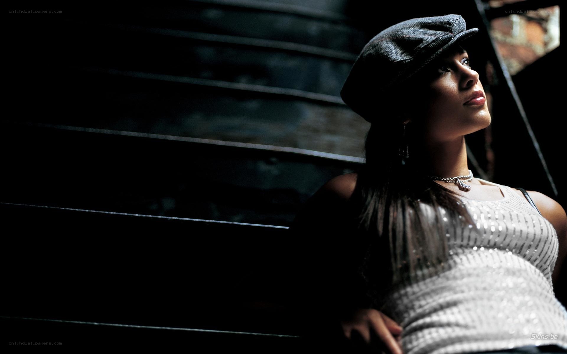 woman in cap looking up