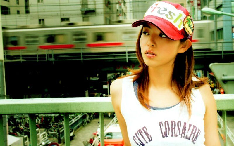 woman in cap on bridge
