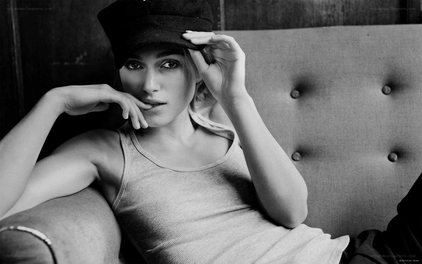 woman in cap on couch