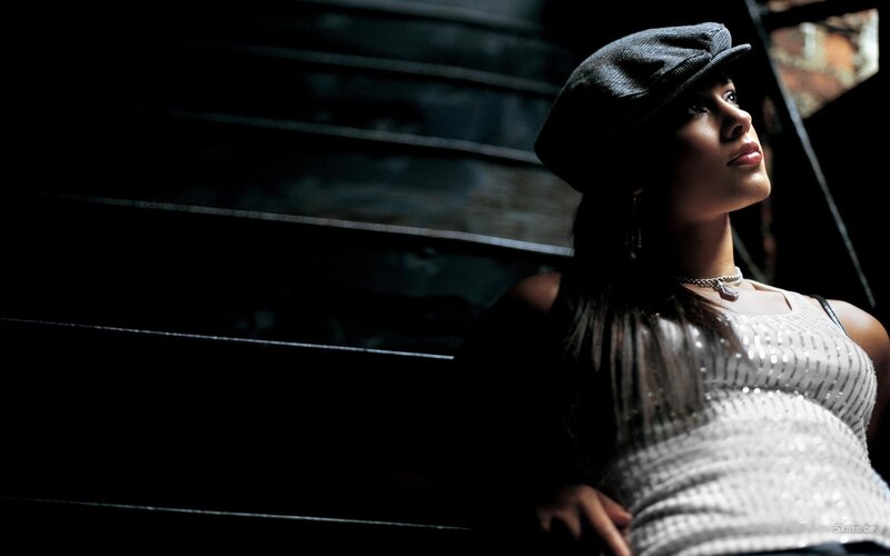 woman in cap on stairs