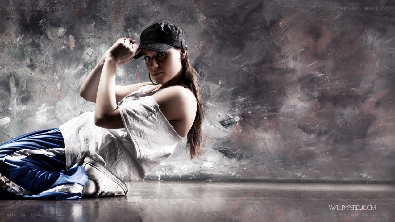 woman in cap posing on floor