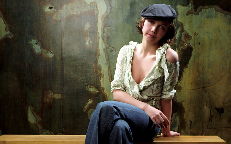 Woman in Cap Sitting