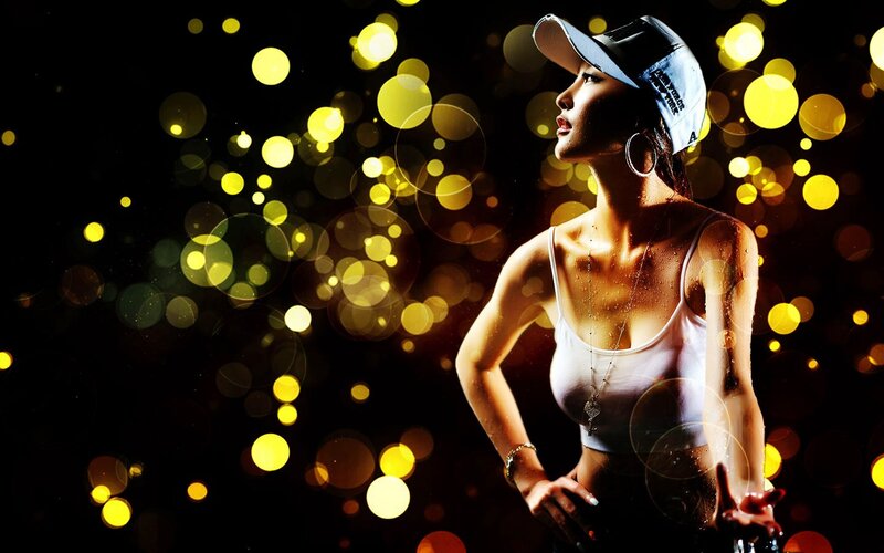 woman in cap with bokeh lights