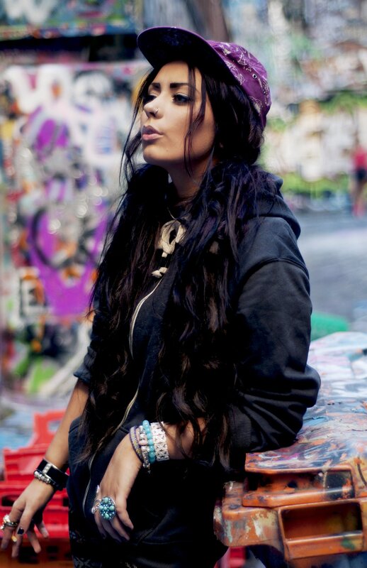 woman in cap with graffiti background