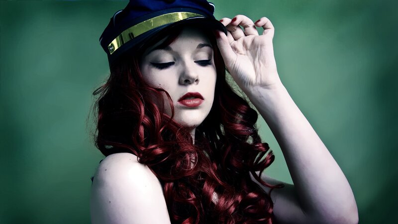 woman in cap with red hair