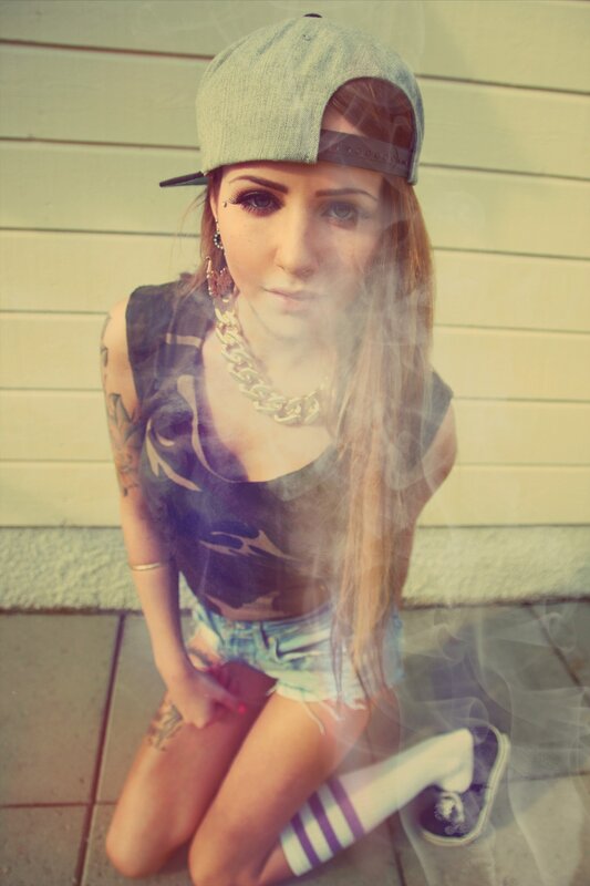 woman in cap with smoke