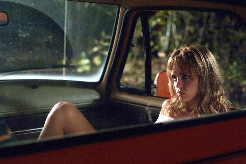 woman in car at night