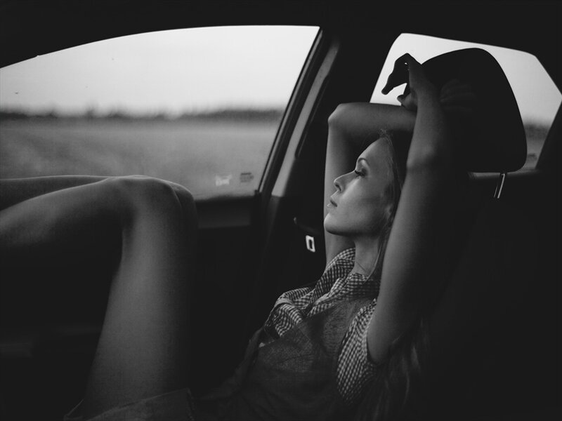 Woman in Car — Black, Contemplative