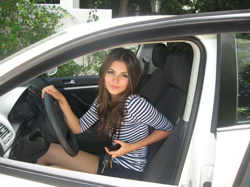 woman in car holding keys