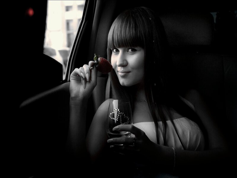Woman in Car Holding Strawberry
