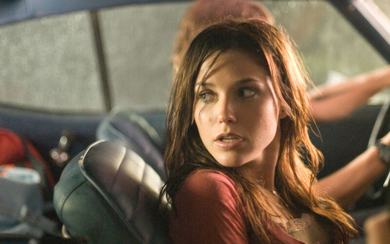 woman in car looking back