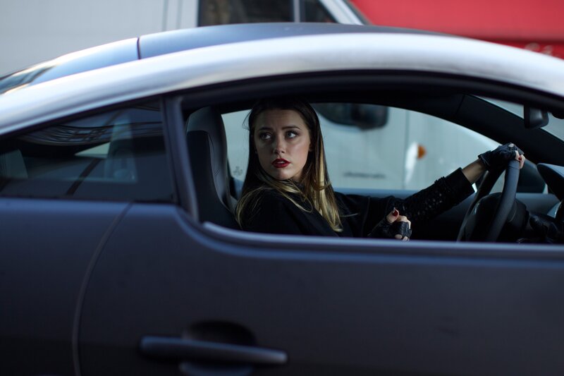 woman in car looking back