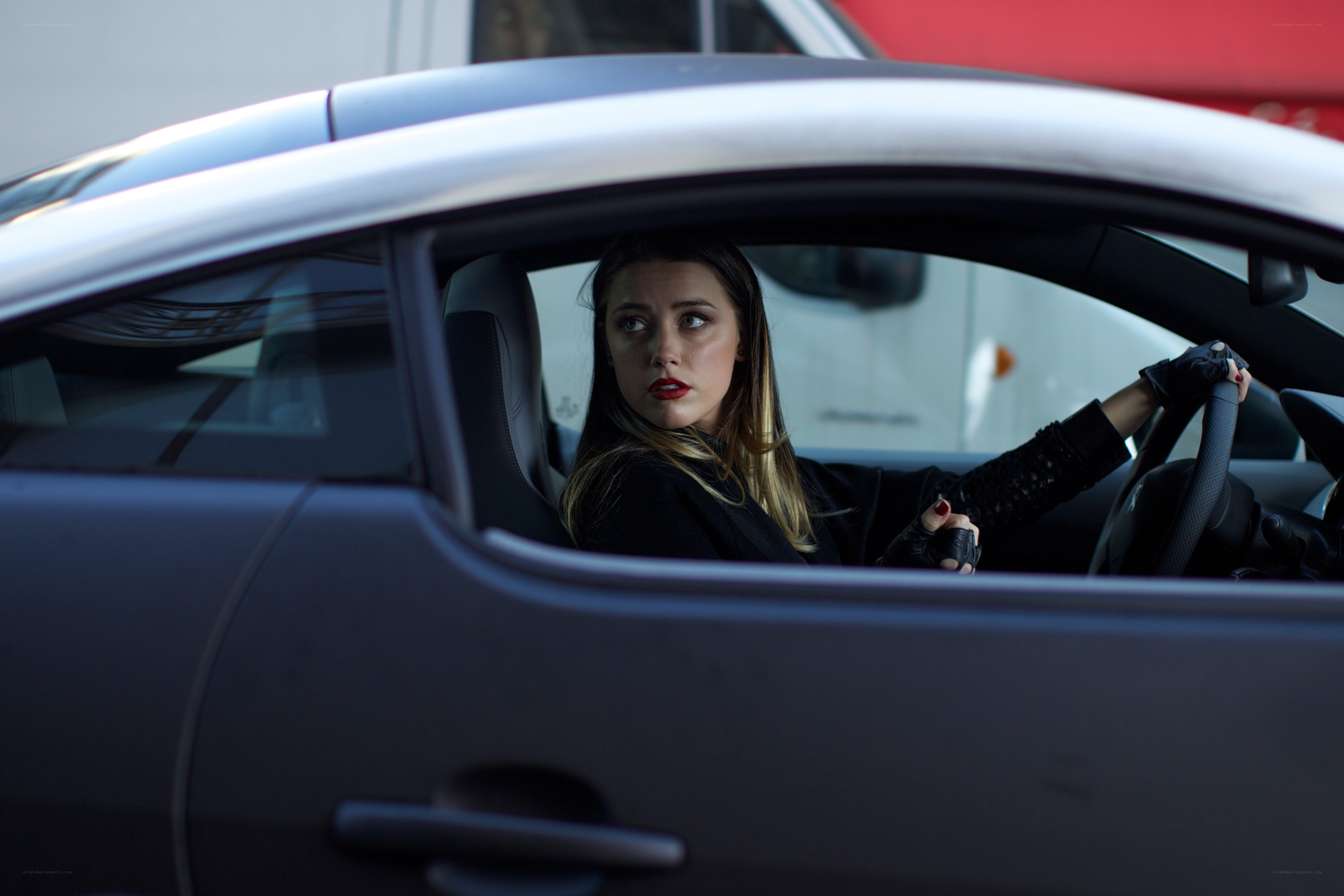 woman in car looking back
