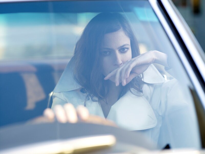 woman in car looking out window