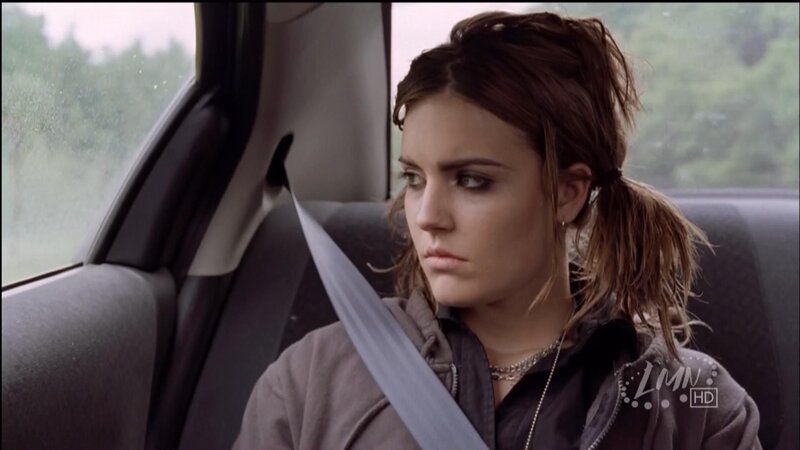 woman in car looking out window