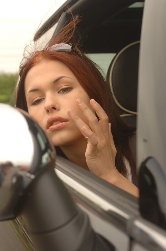 woman in car looking out window