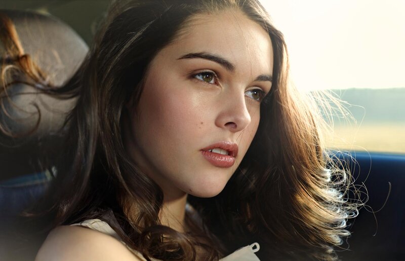 woman in car looking out window