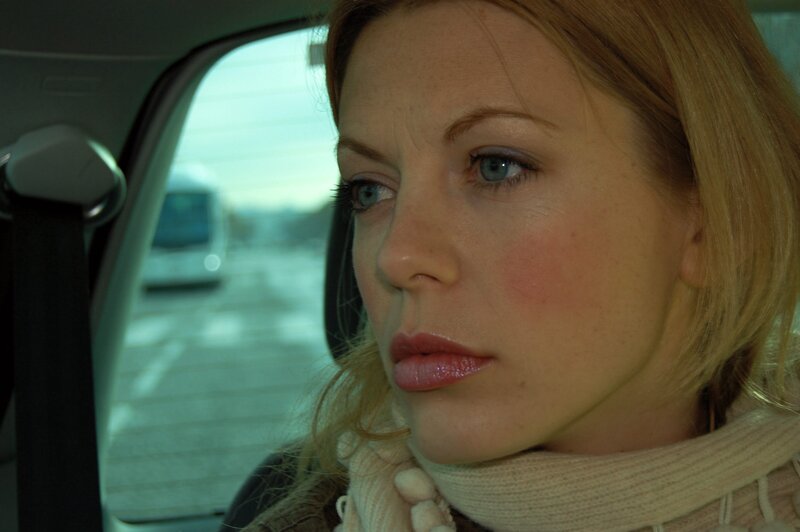 woman in car looking out window