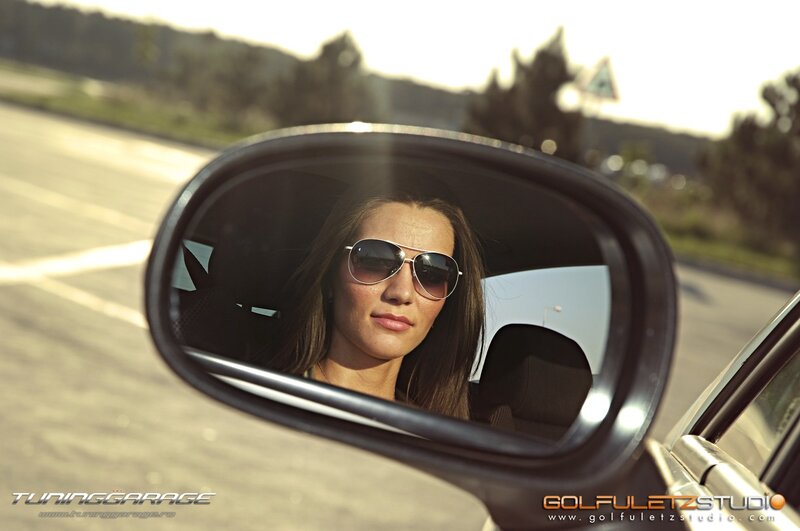 woman in car mirror