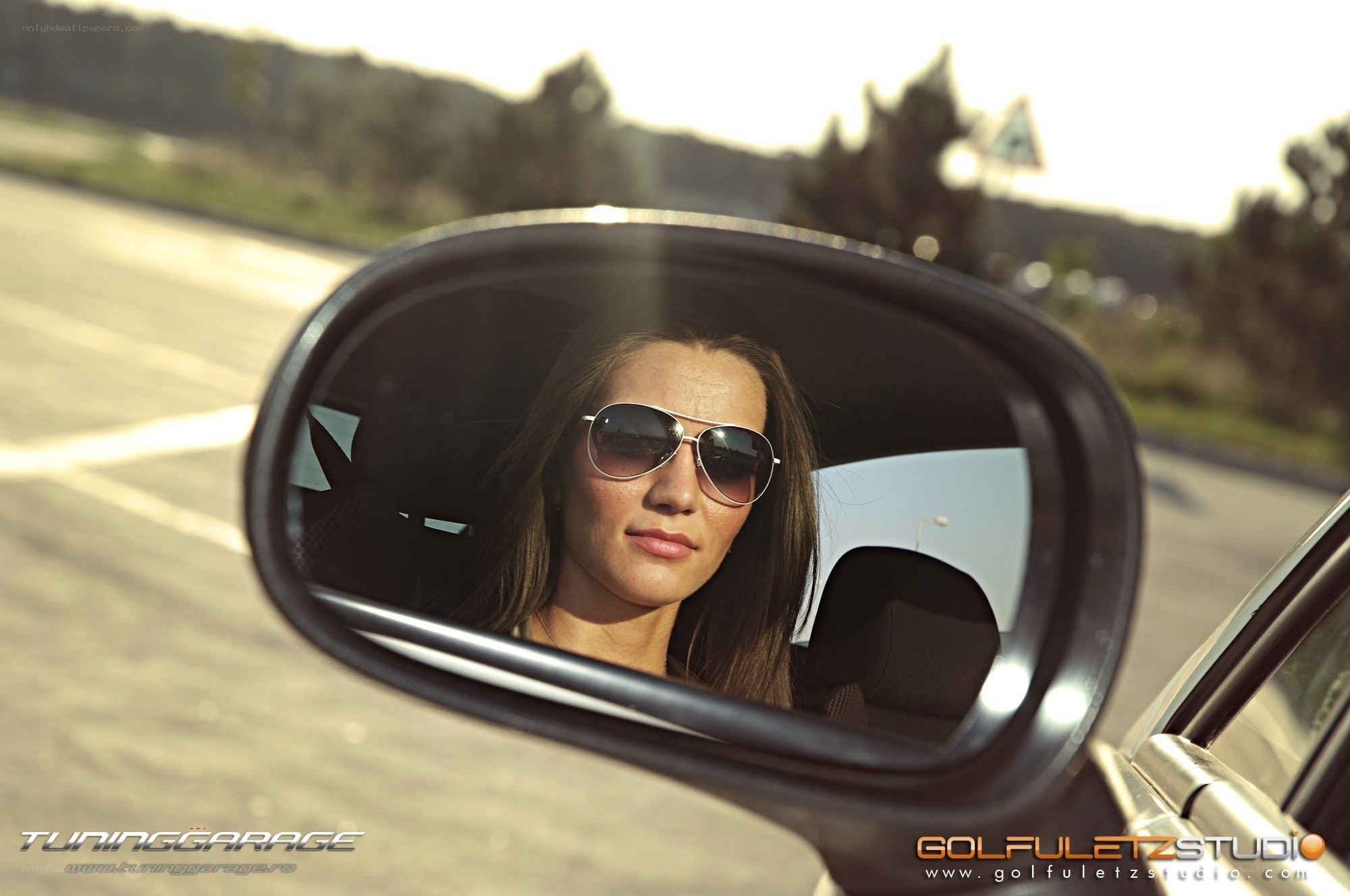 woman in car mirror