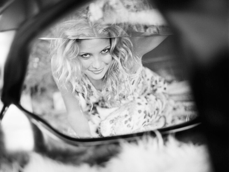 woman in car mirror reflection