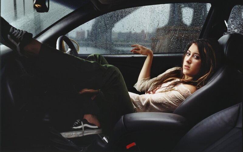 woman in car on rainy day