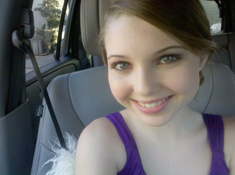 woman in car smiling