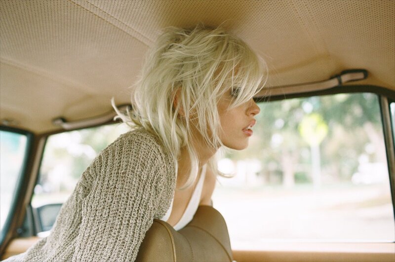 woman in car with blonde hair