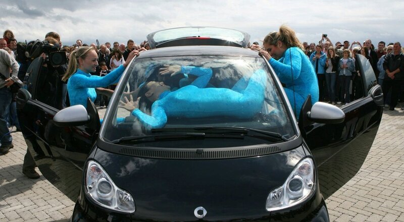 woman in car with blue suit