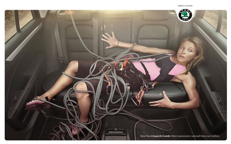 Woman in car with climbing gear