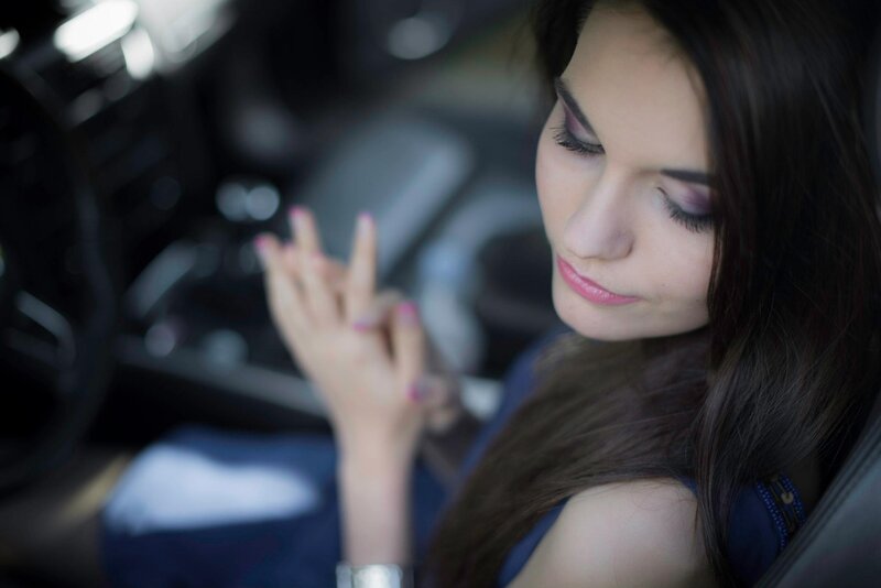 woman in car with eyes closed