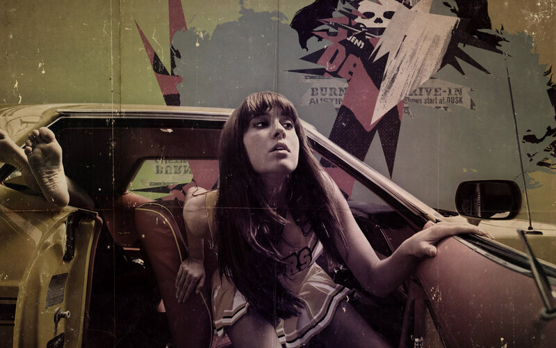 woman in car with graffiti background