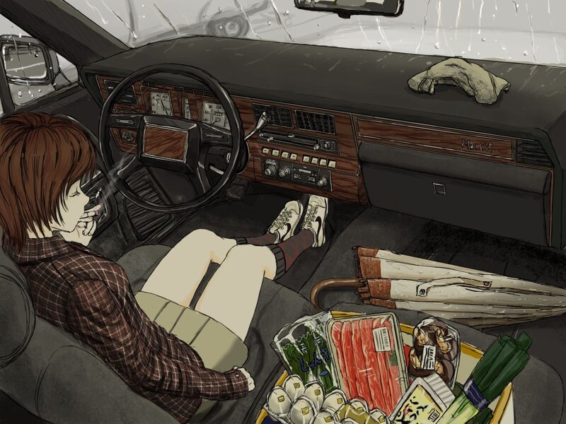 Woman in car with groceries