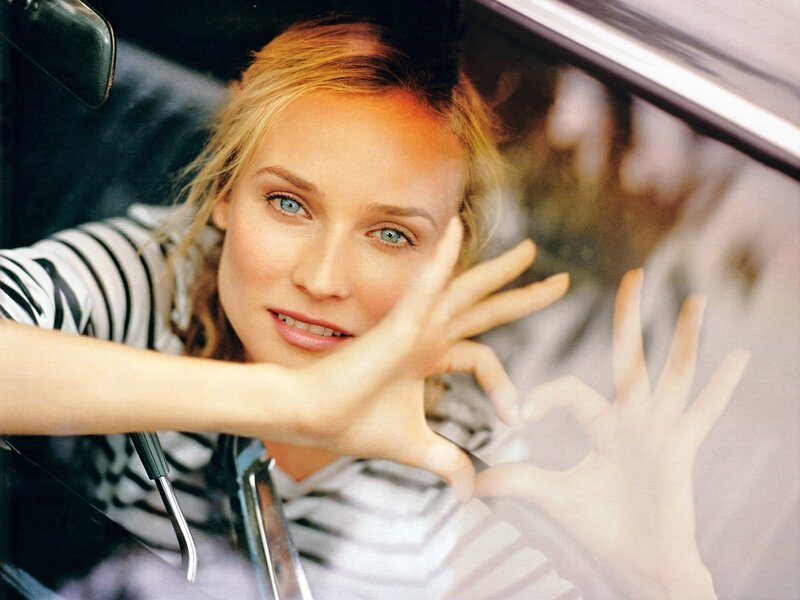 woman in car with hand gesture