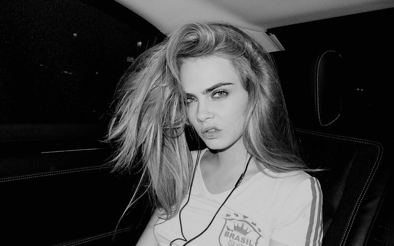 woman in car with headphones