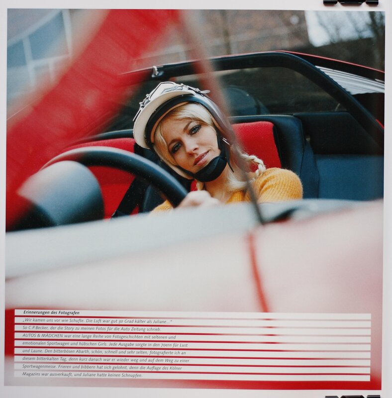Woman in car with helmet