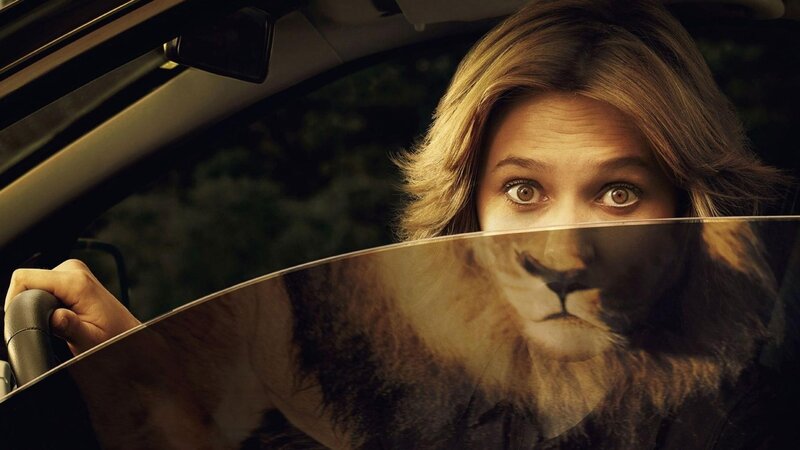 Woman in Car with Lion Face — Brown, Dramatic